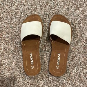 Size 7 white and tan slip on sandals